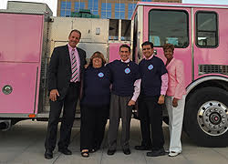 Council in front of pink fire truck